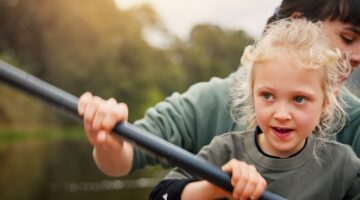 A mum and child kayaking.
