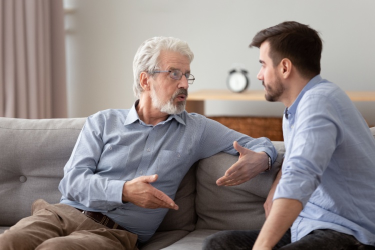 A father and son having a serious conversation.