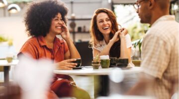 A group of friends talking in a café.