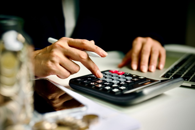 A person using a calculator.