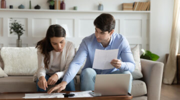 Couple reviewing finances at home