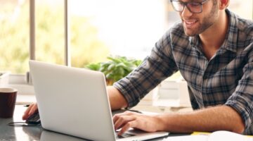 A man using a laptop.