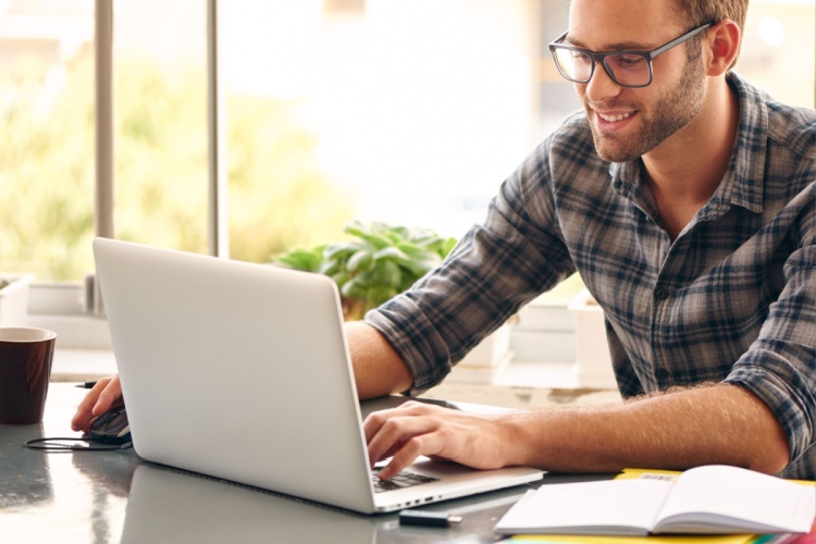 A man using a laptop.