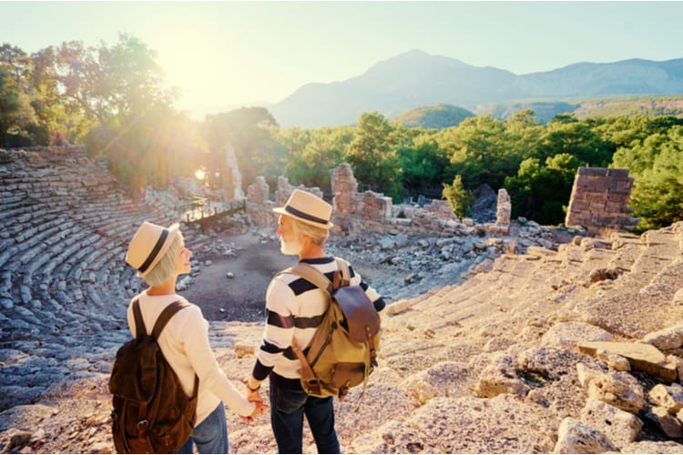 A mature couple visiting an ancient amphitheatre.