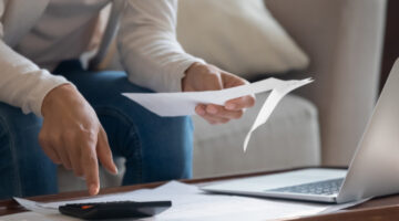 A person looking through paperwork.