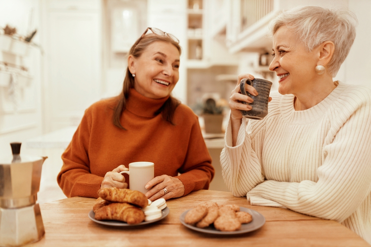 Two friends talking over a coffee.