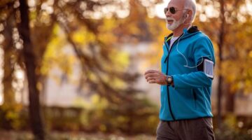 A man jogging in a park.
