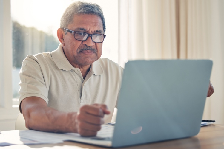 A man using a laptop.