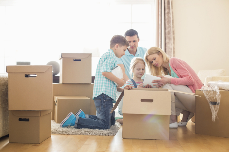 A family unpacking boxes in a new home.